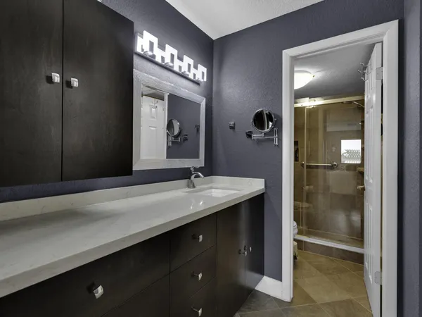 a bathroom with a sink and a mirror