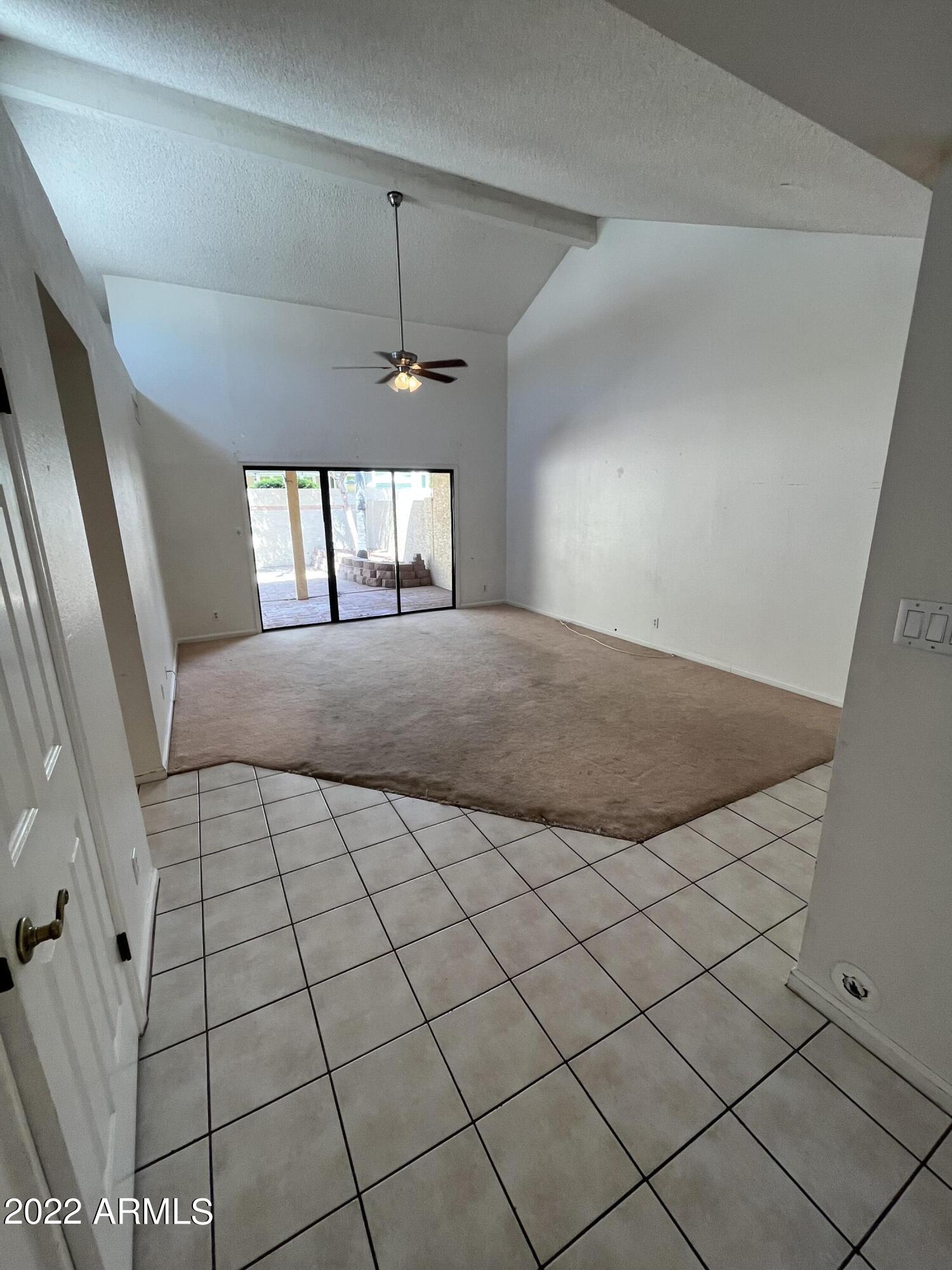 5505 East McLellan Road, Unit 56 Mesa, AZ 85205 - Photo 2 of 11 a view of a livingroom with a window