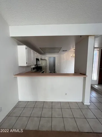 a kitchen with cabinets and white appliances