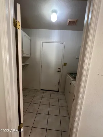 a bathroom with a granite countertop shower and a sink