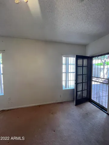 a view of an empty room with a window