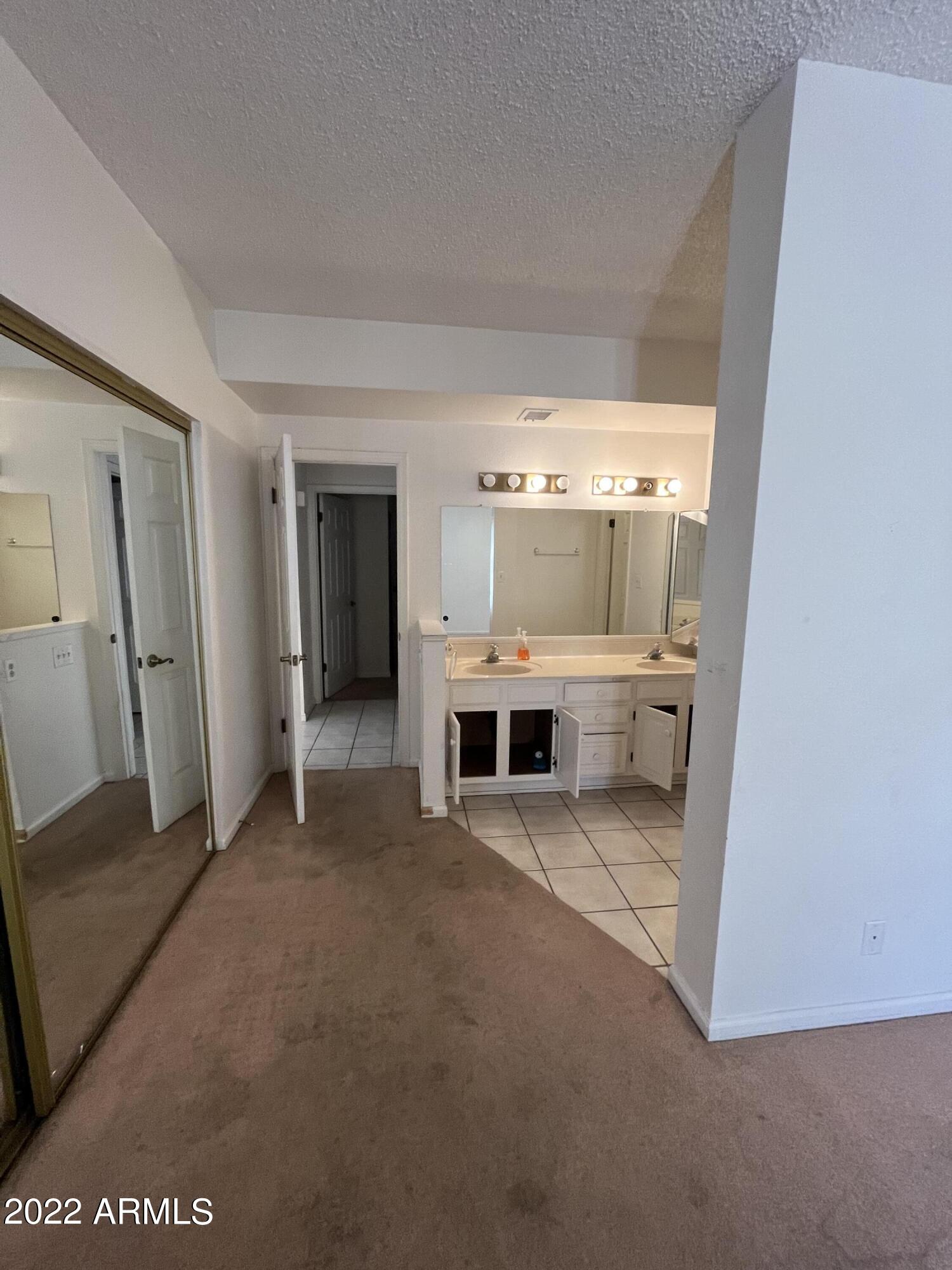 5505 East McLellan Road, Unit 56 Mesa, AZ 85205 - Photo 10 of 11 a view of a room with furniture and a fireplace