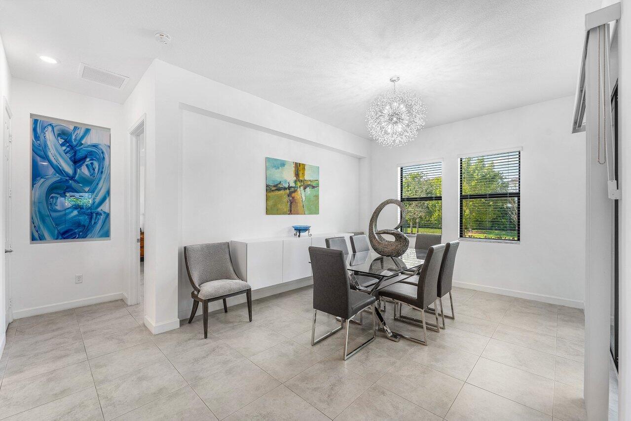 1119 Arrowhead Point Road Loxahatchee, FL 33470 - Photo 21 of 106 Bright dining room with two windows