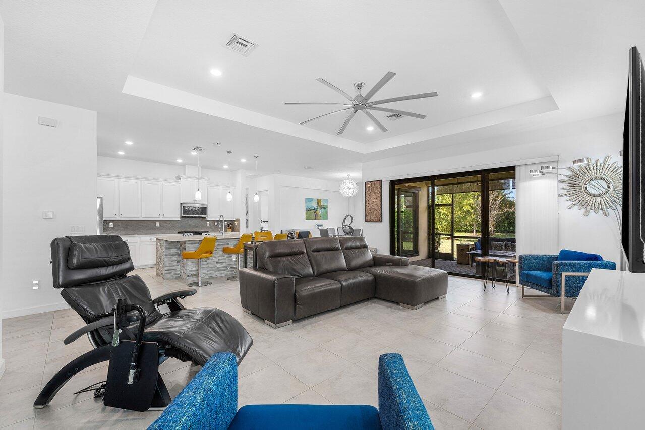 1119 Arrowhead Point Road Loxahatchee, FL 33470 - Photo 23 of 106 Great room, kitchen, and dining view