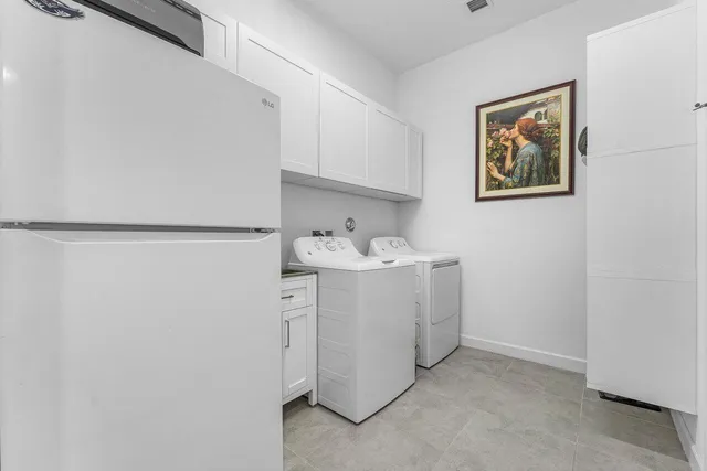 a living room with furniture a dining table and a large window