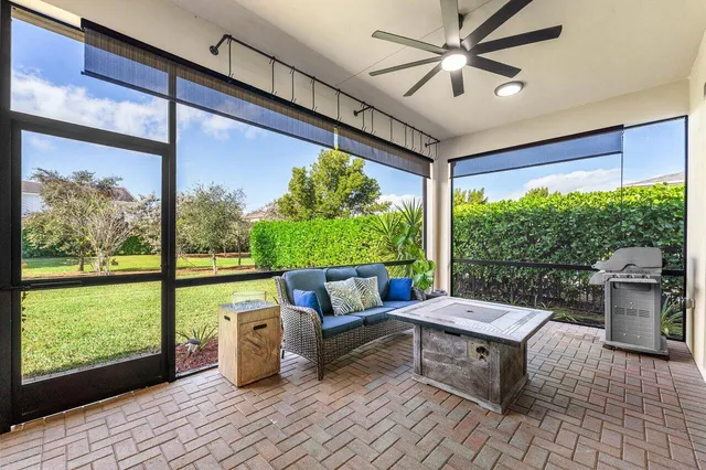 a view of a balcony with wooden floor and outdoor seating