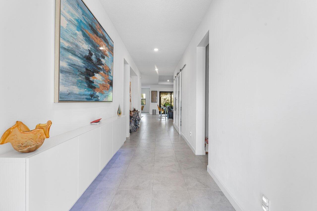 1119 Arrowhead Point Road Loxahatchee, FL 33470 - Photo 5 of 106 Extended view of foyer entering home