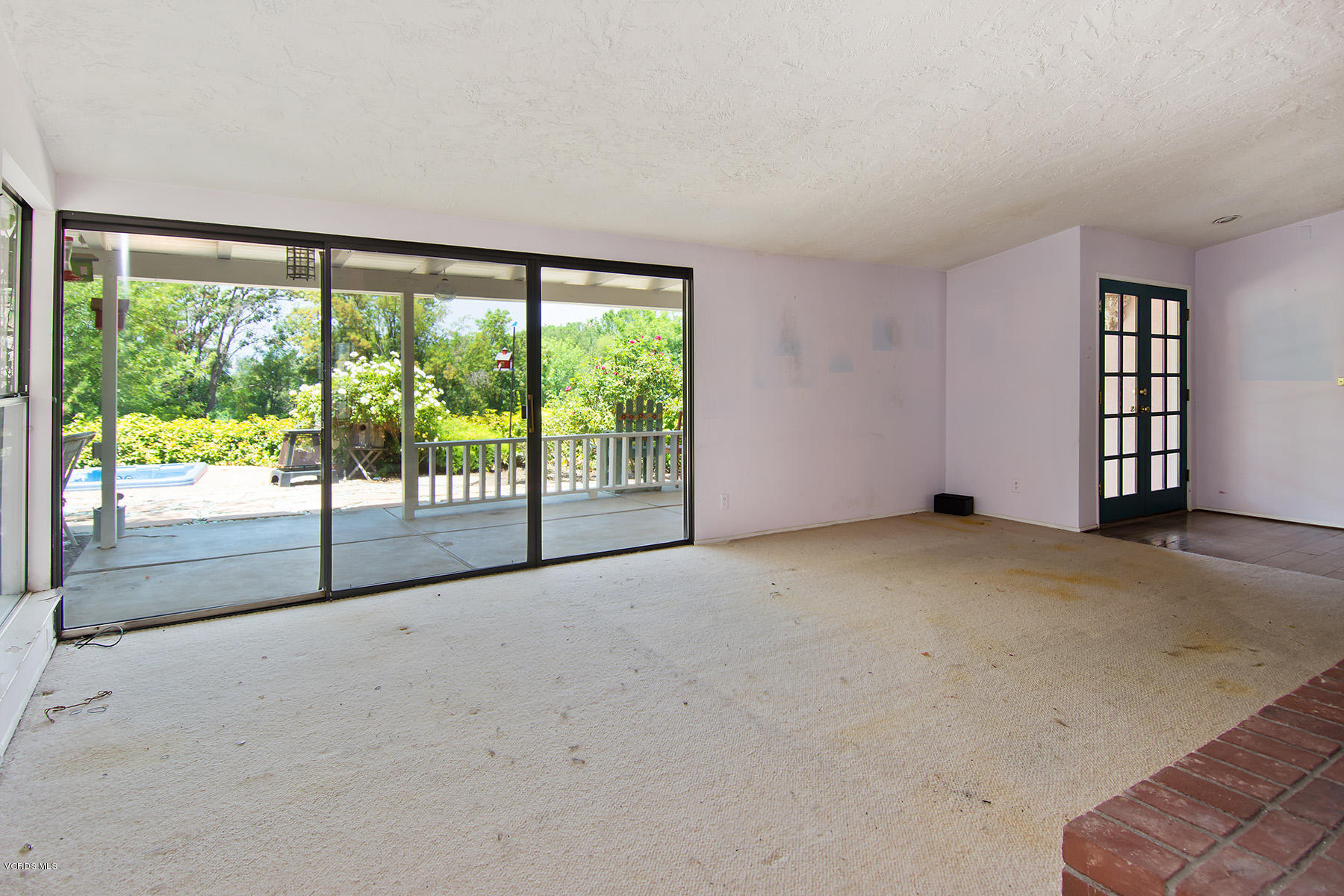 Living Room Sliding Door to Backyard