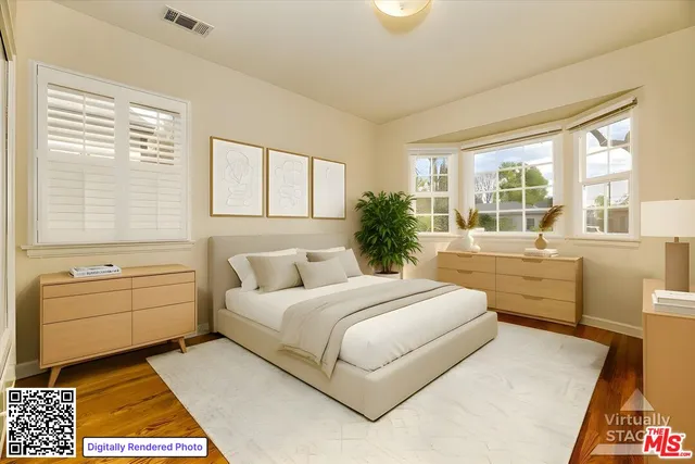 a room with a bed and a dresser