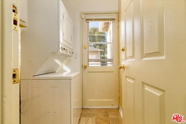 a bathroom with a shower and a door