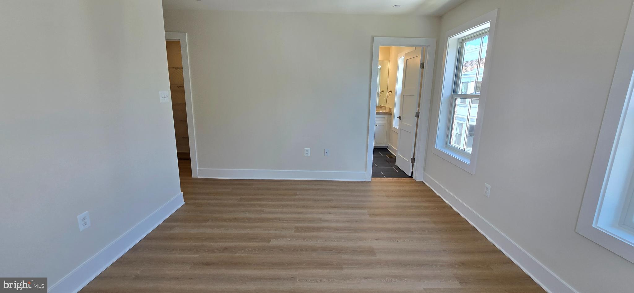 418 Chapel Alley, Unit 4 Frederick, MD 21701 - Photo 24 of 41 a view of a hallway with wooden floor and closet