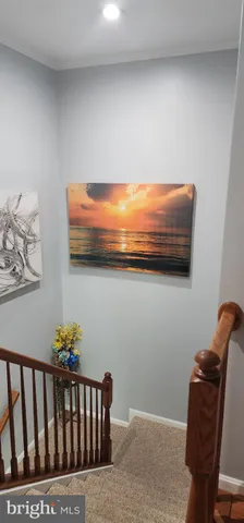 a room with furniture stairs and a window