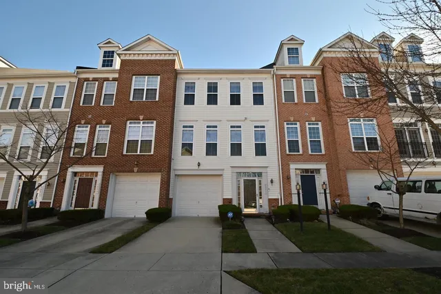 a front view of a building with many windows