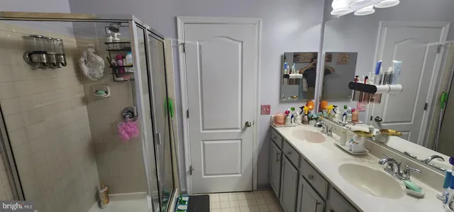 a bathroom with a bathtub and shower