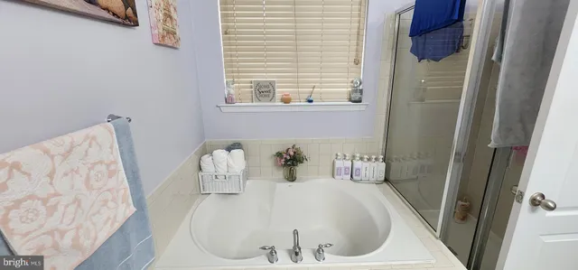 a bathroom with a sink toilet and mirror