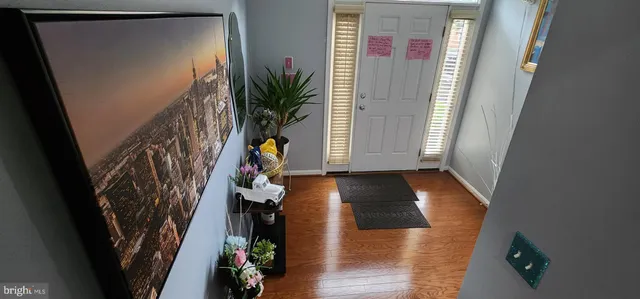 a view of entryway with wooden floor
