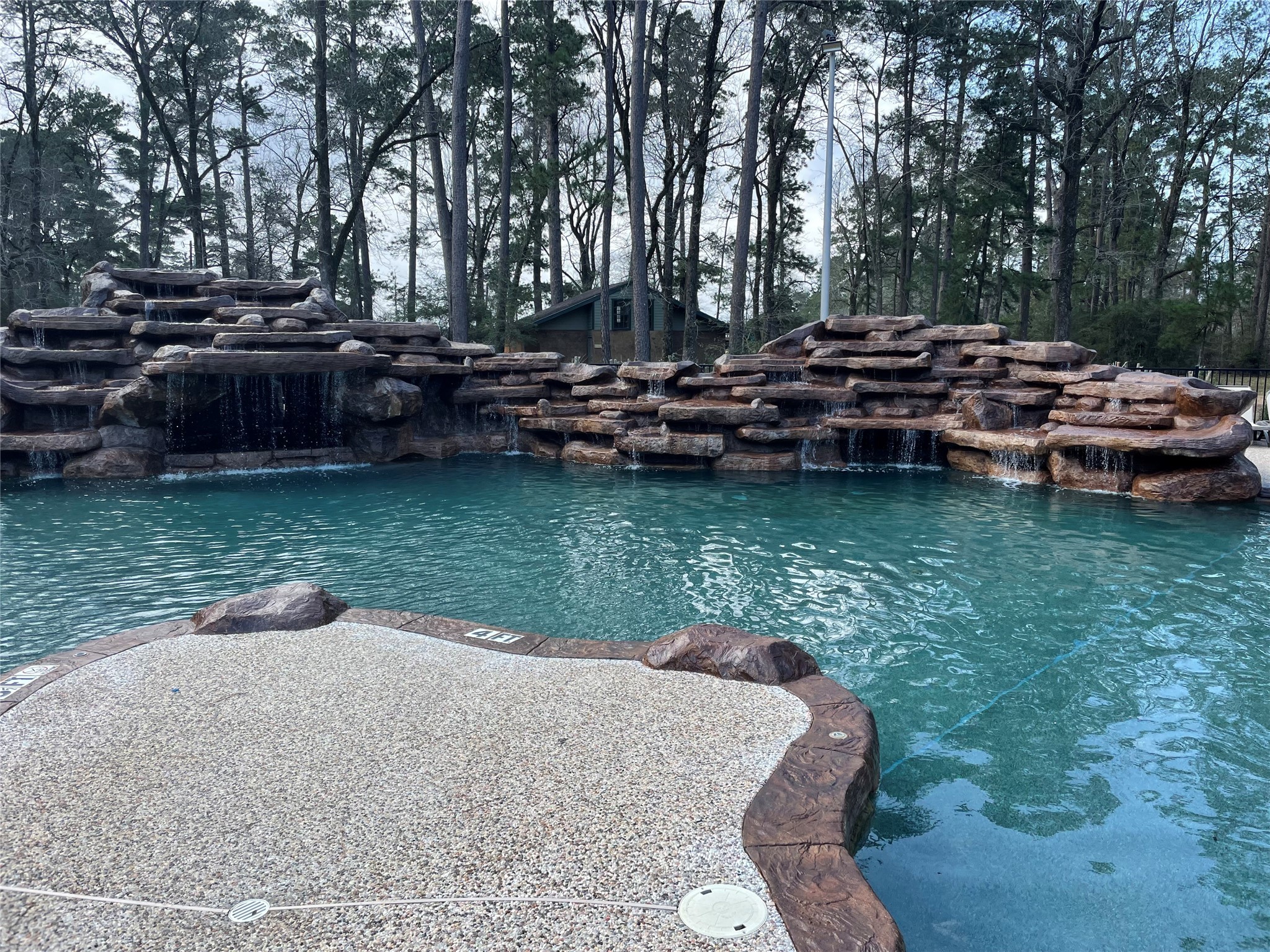 63 Smith Loop South Cleveland, TX 77327 - Photo 23 of 23 a view of swimming pool and patio