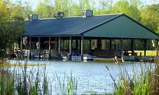 63 Smith Loop South Cleveland, TX 77327 - Photo 5 of 23 a view of a backyard with a patio and wooden floor