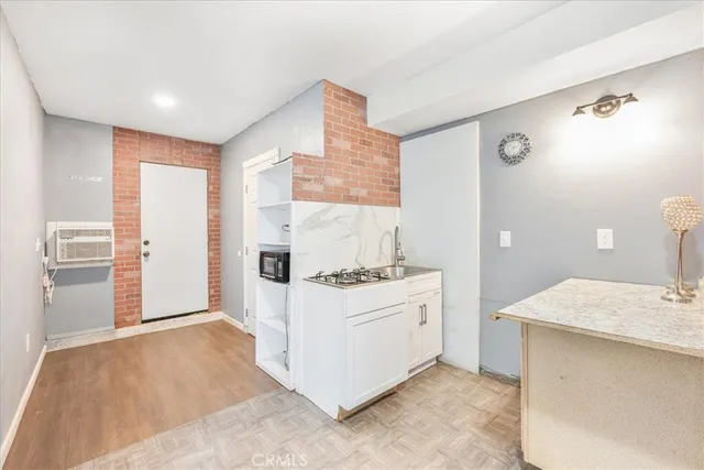a kitchen with a stove and a refrigerator