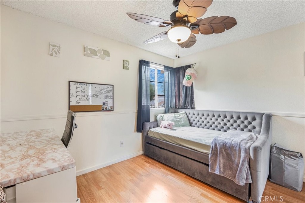 507 Coudures Way Perris, CA 92571 - Photo 26 of 41 a living room with a bed furniture and decor