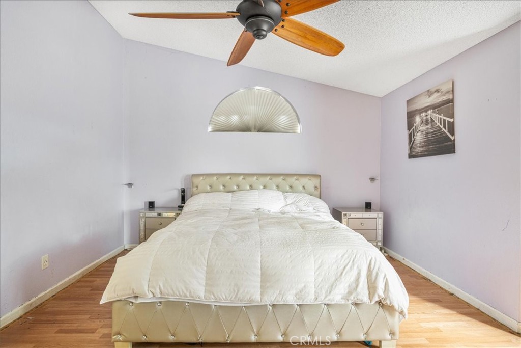 507 Coudures Way Perris, CA 92571 - Photo 31 of 41 a large bed sitting in a bedroom next to a window