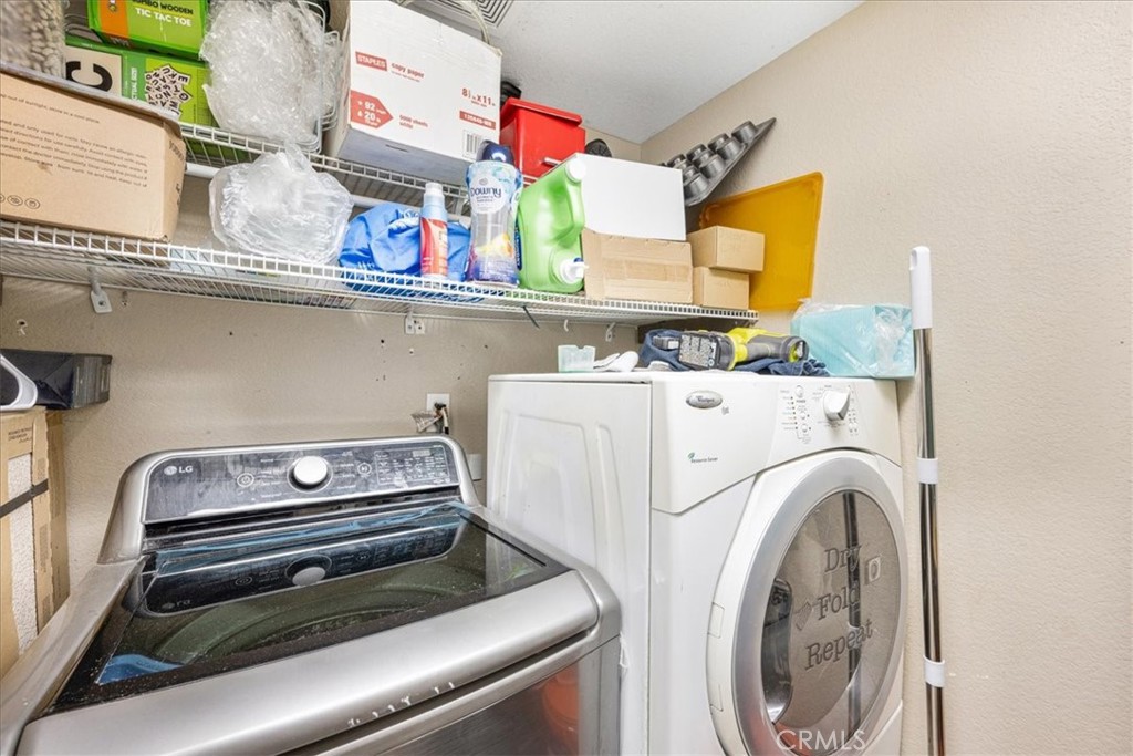 507 Coudures Way Perris, CA 92571 - Photo 37 of 41 a utility room with dryer and washer