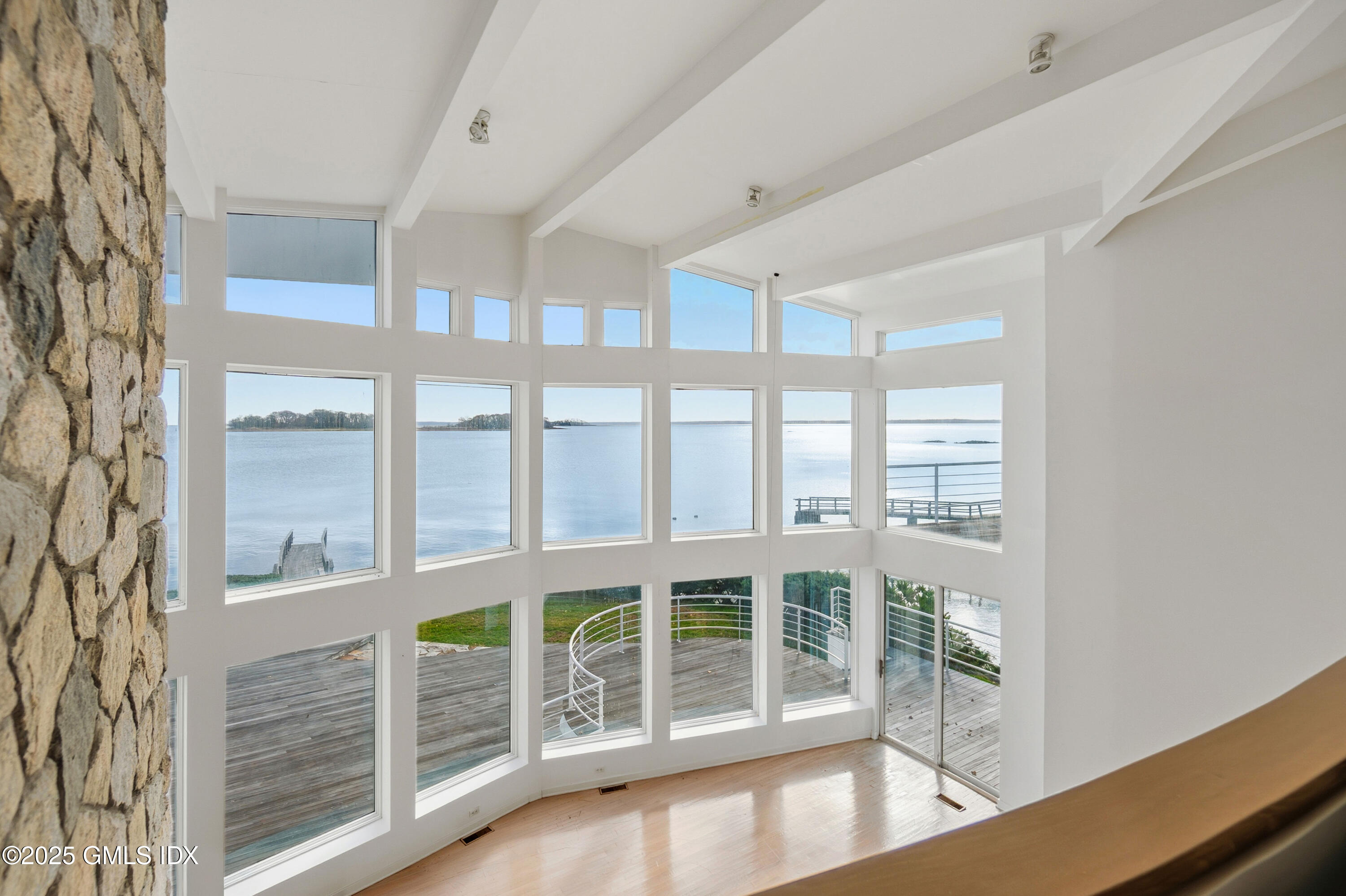 111 Byram Shore Road Greenwich, CT 06830 - Photo 8 of 23 a view of an empty room with windows
