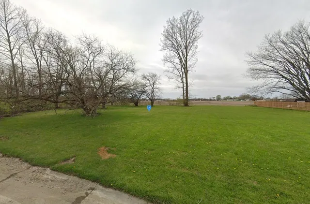 a backyard of a house with lots of green space