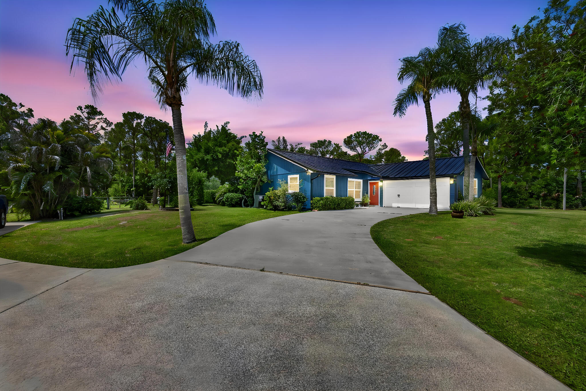 12558 165th Road North Jupiter, FL 33478 - Photo 57 of 67 a view of a house with palm trees