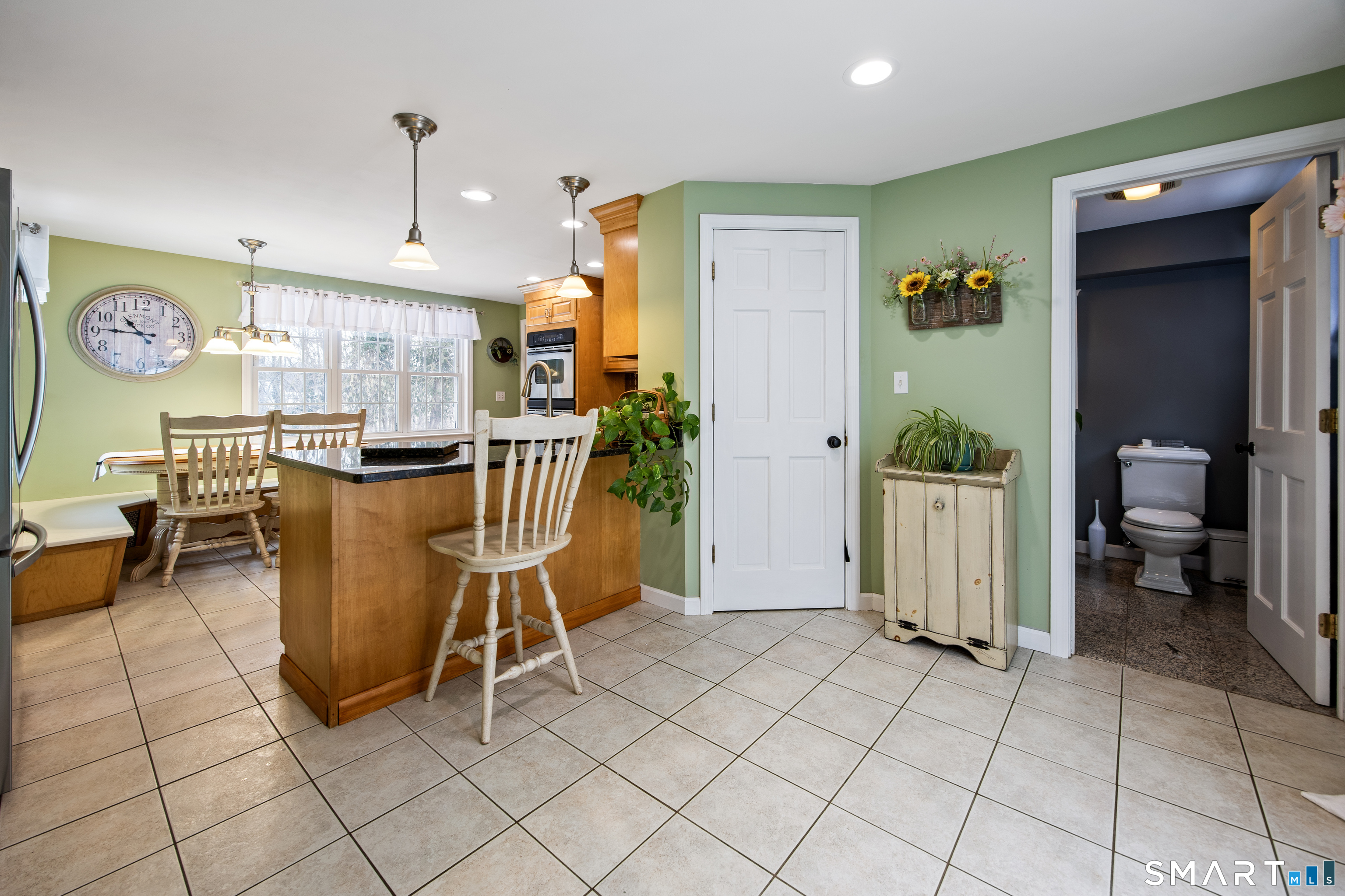 1023 King Road Cheshire, CT 06410 - Photo 21 of 40 Kitchen, dining area and bathroom with sliders to rear patio space