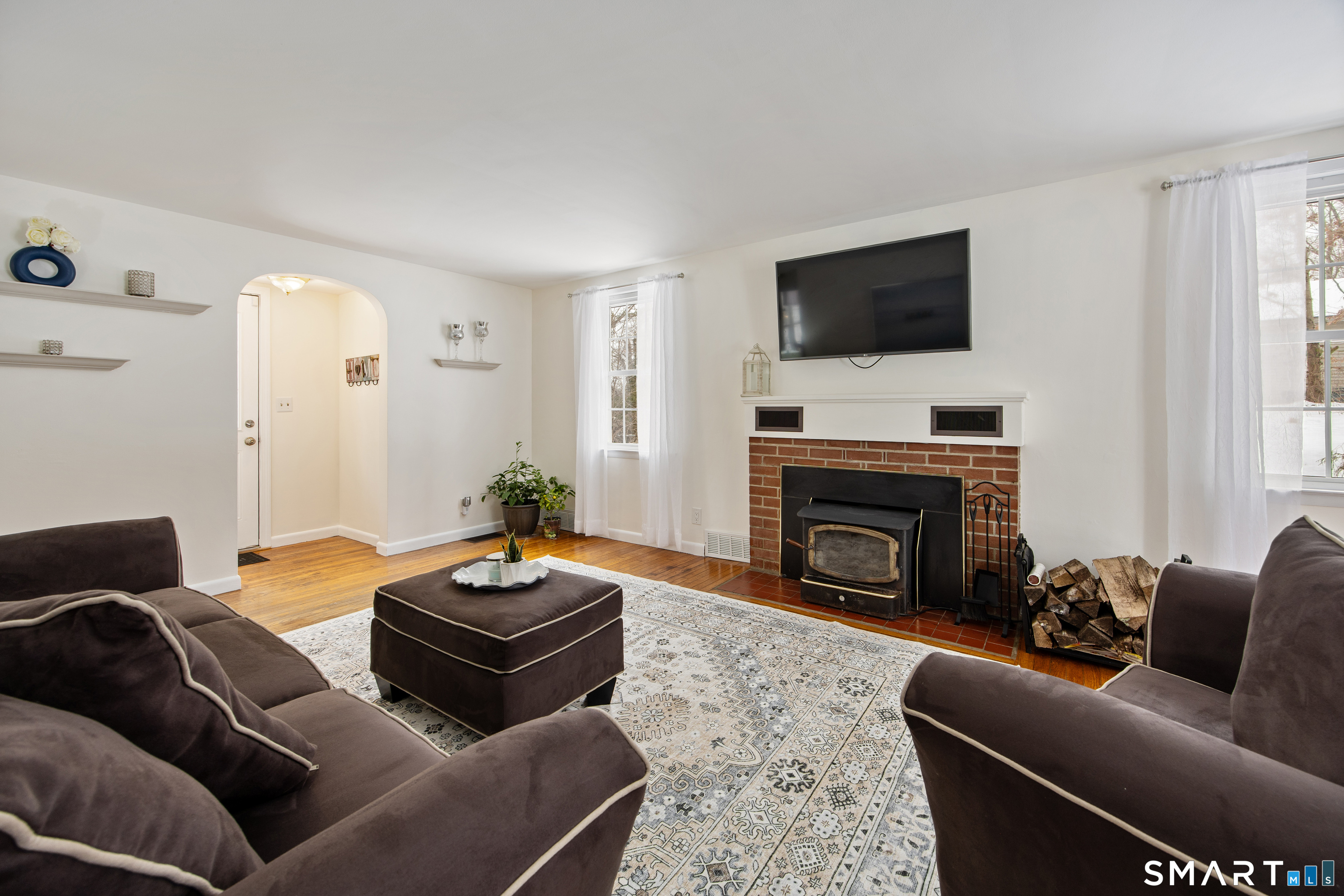 1023 King Road Cheshire, CT 06410 - Photo 24 of 40 Living room with wood insert fireplace