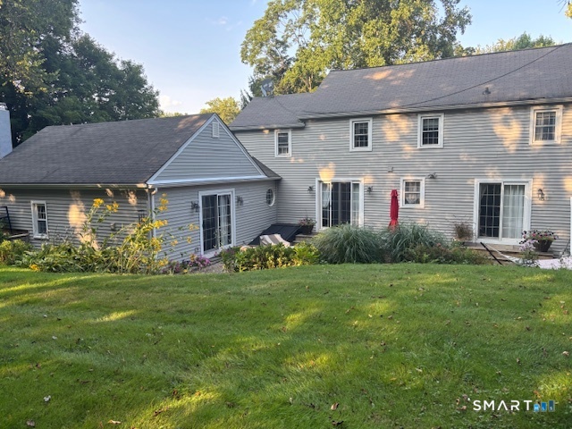 1023 King Road Cheshire, CT 06410 - Photo 3 of 40 Rear of home, with patio and sitting area, surrounded by gardens and a fire pit