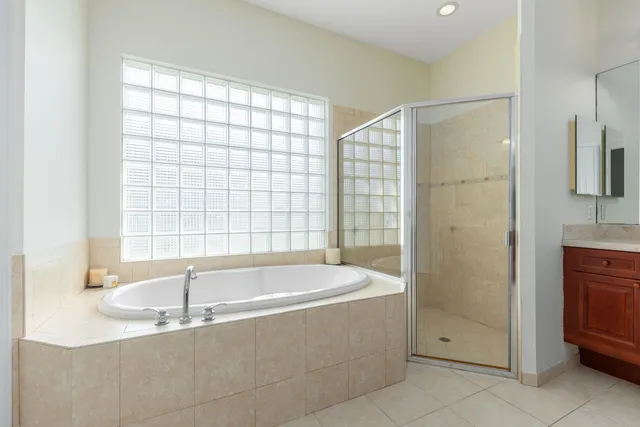 a bathroom with a bathtub and a shower