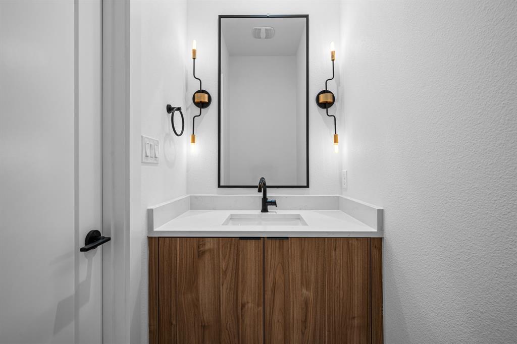 1014 Grandview Avenue Dallas, TX 75223 - Photo 12 of 30 a bathroom with a sink and a mirror
