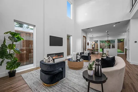 a kitchen with a sink a stove and a wooden floors
