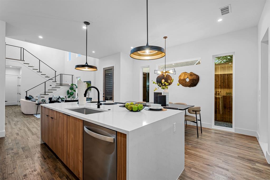 1014 Grandview Avenue Dallas, TX 75223 - Photo 14 of 30 a kitchen with a sink a stove and a wooden floors
