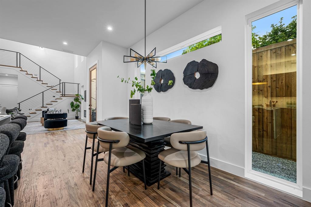 1014 Grandview Avenue Dallas, TX 75223 - Photo 16 of 30 a view of a dining room with furniture wooden floor and chandelier
