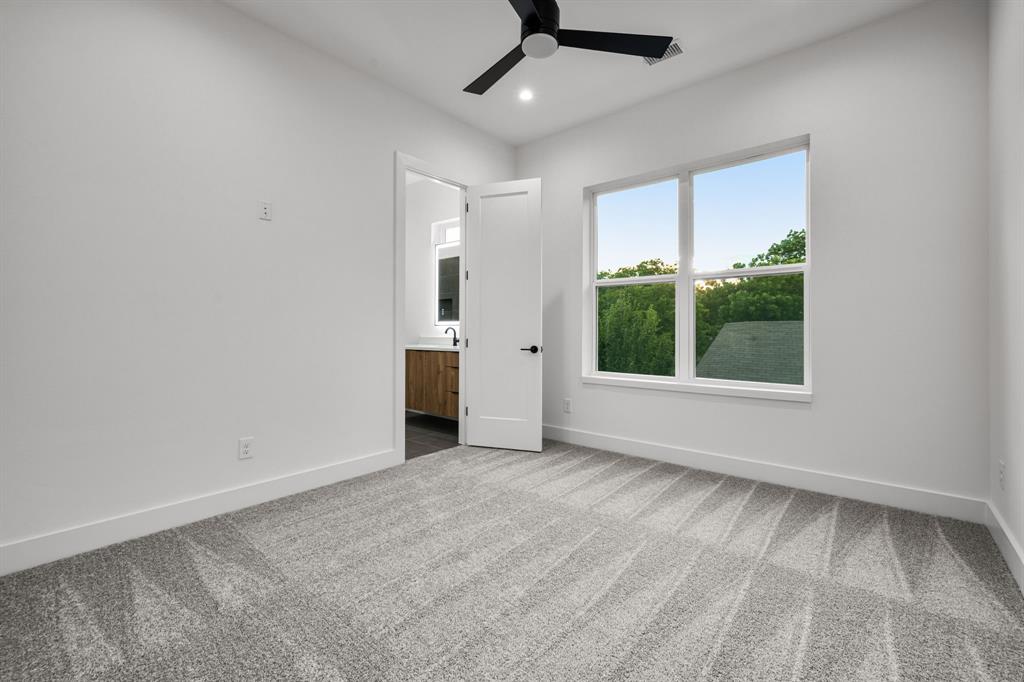 1014 Grandview Avenue Dallas, TX 75223 - Photo 25 of 30 wooden floor in an empty room with a window