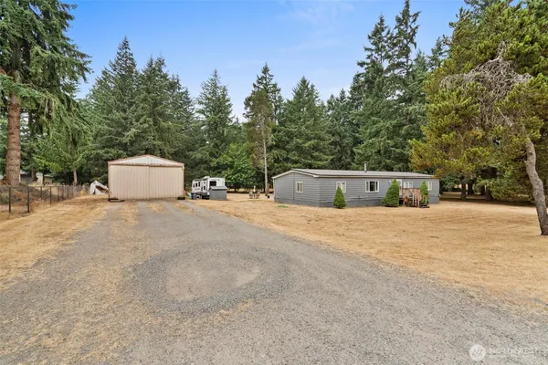 a view of the house with a yard