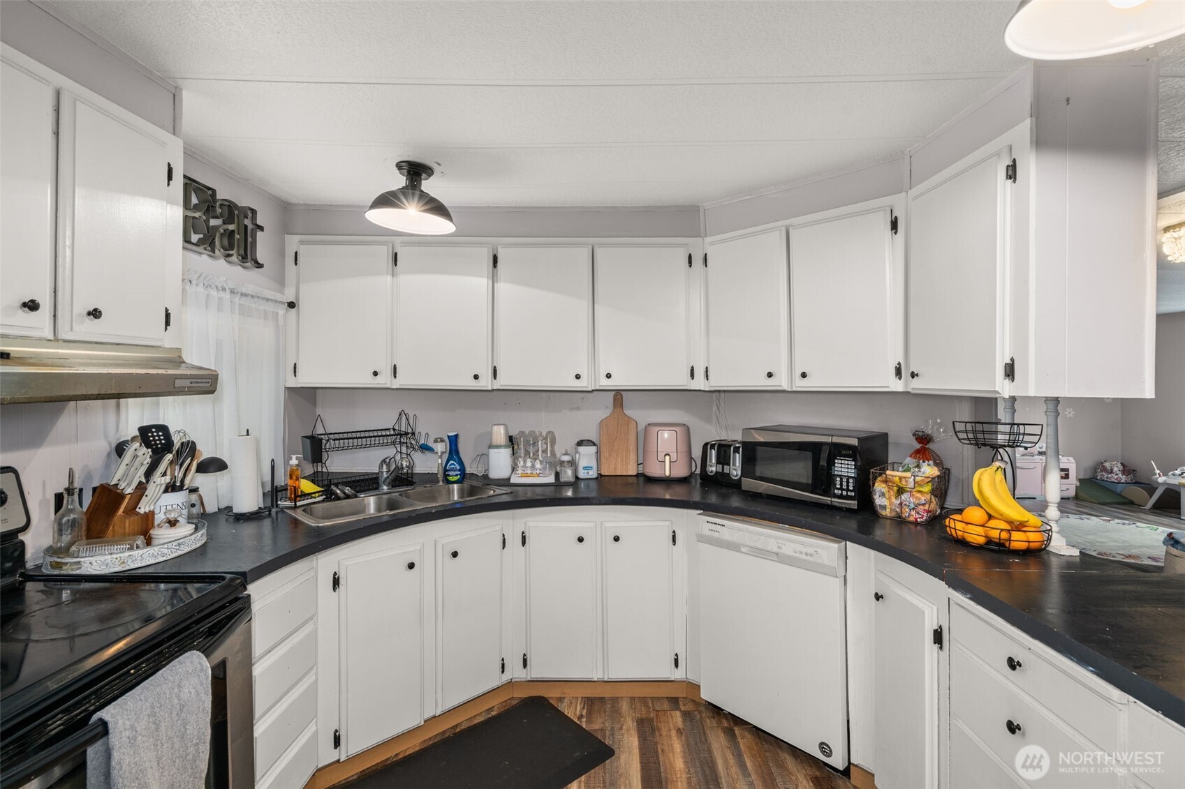 19121 Elderberry Street Southwest Rochester, WA 98579 - Photo 13 of 34 a kitchen with stainless steel appliances granite countertop a sink a stove and cabinets