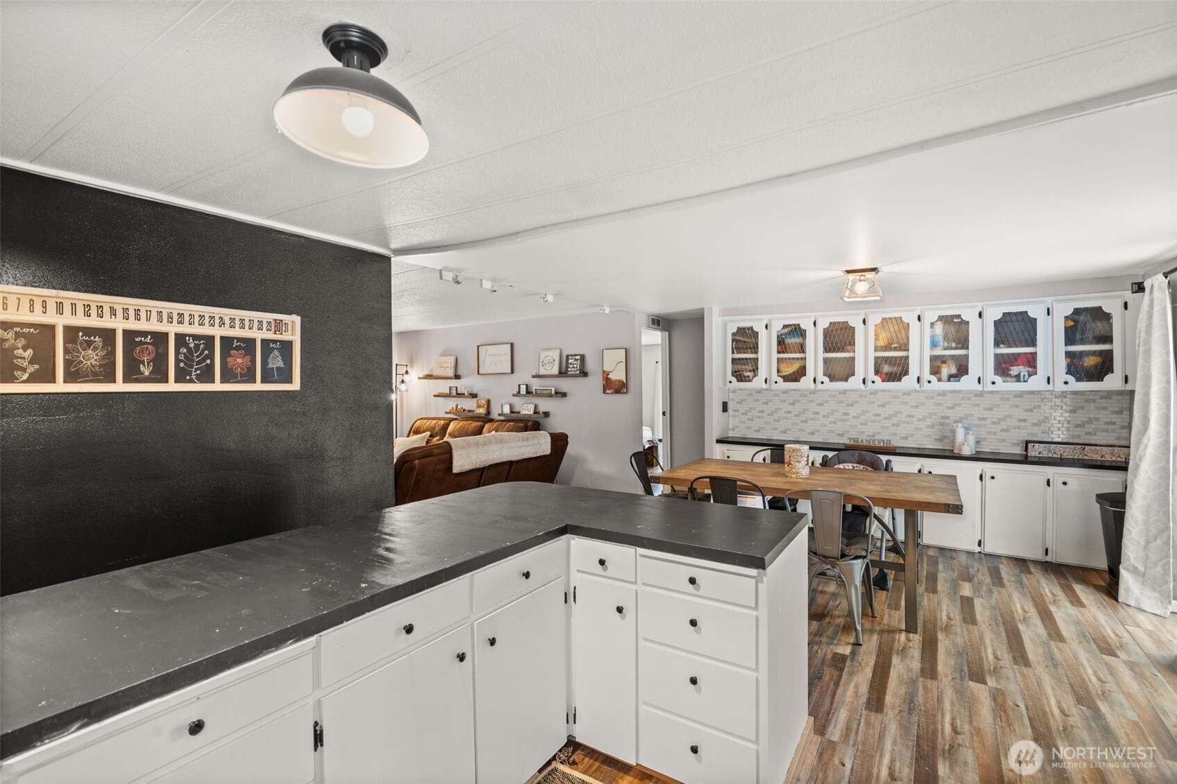 19121 Elderberry Street Southwest Rochester, WA 98579 - Photo 14 of 34 a kitchen with a counter space a stove and cabinets