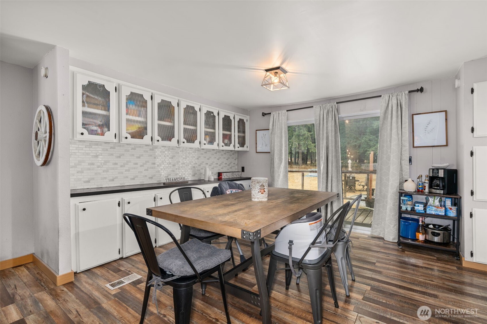 19121 Elderberry Street Southwest Rochester, WA 98579 - Photo 15 of 34 a view of a dining room with furniture window and wooden floor