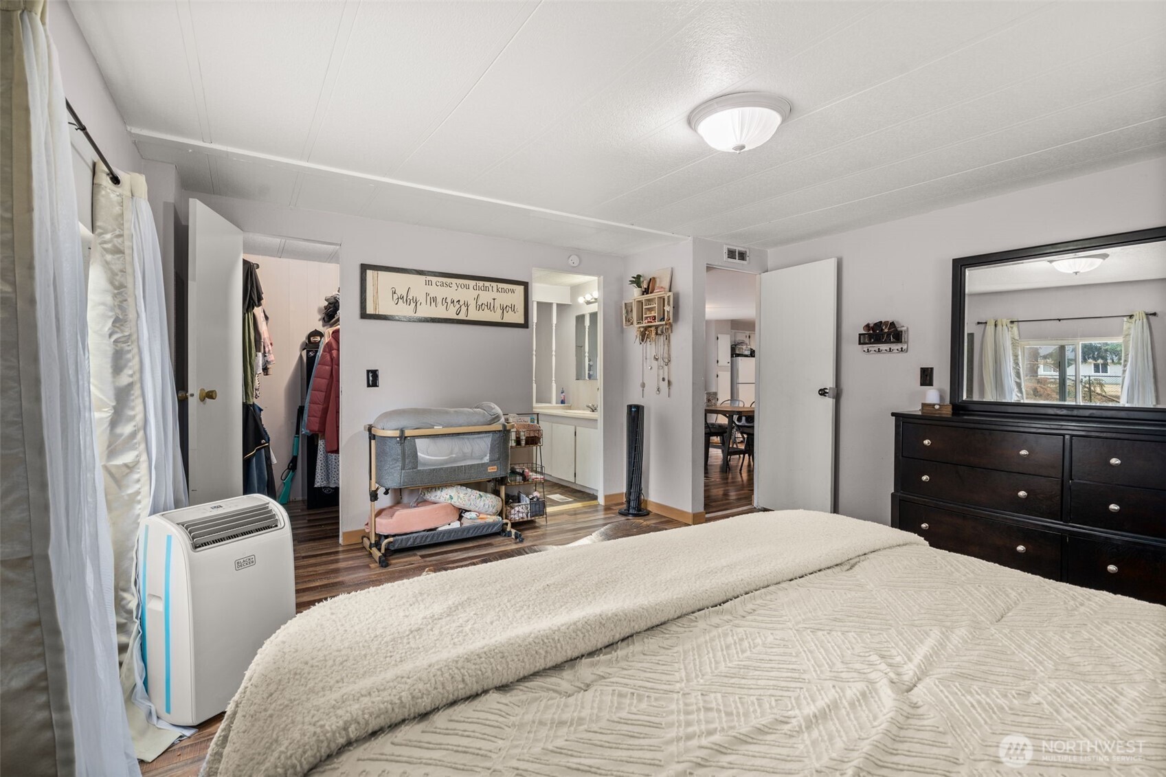 19121 Elderberry Street Southwest Rochester, WA 98579 - Photo 17 of 34 a bedroom with a bed and a mirror on the dresser