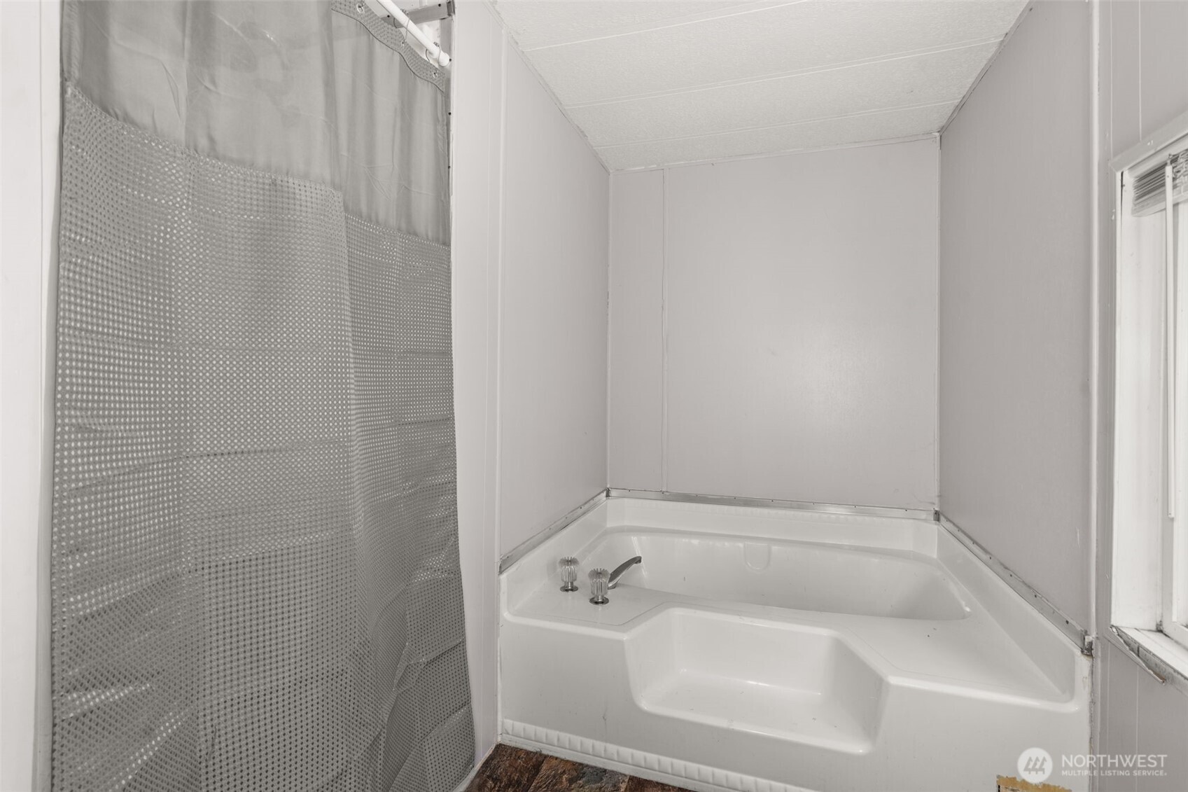 19121 Elderberry Street Southwest Rochester, WA 98579 - Photo 19 of 34 a white bath tub sitting next to a white sink