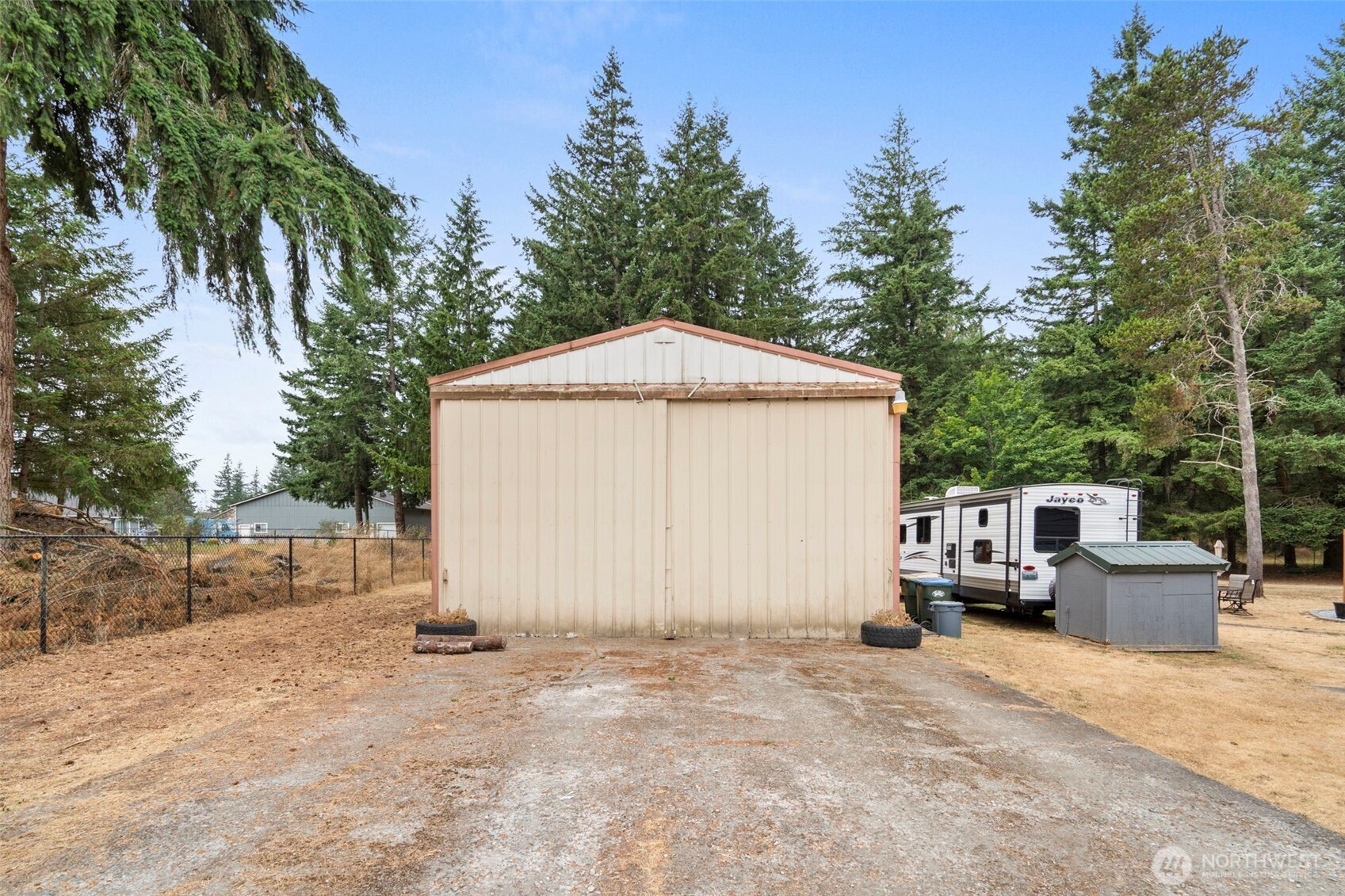 19121 Elderberry Street Southwest Rochester, WA 98579 - Photo 2 of 34 a view of a house with backyard and trees