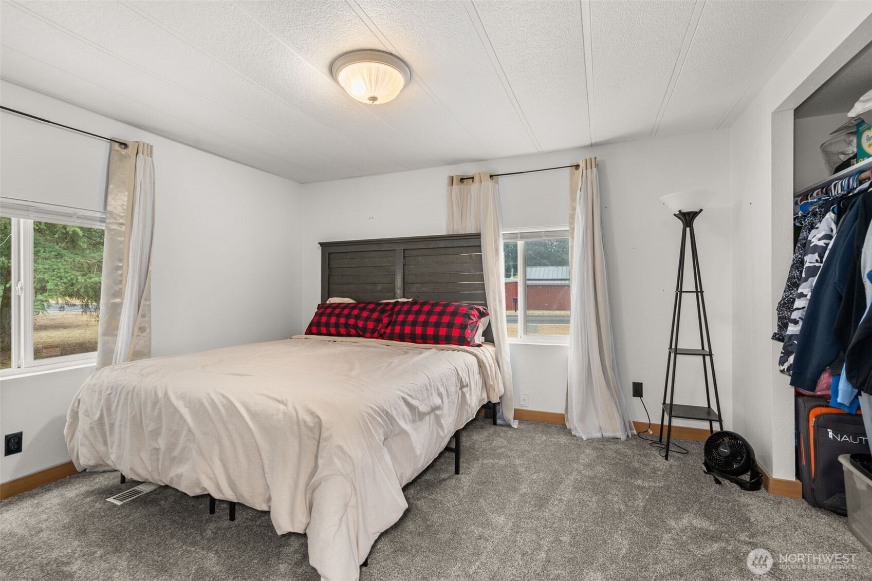 19121 Elderberry Street Southwest Rochester, WA 98579 - Photo 21 of 34 a bed room with a bed and a window