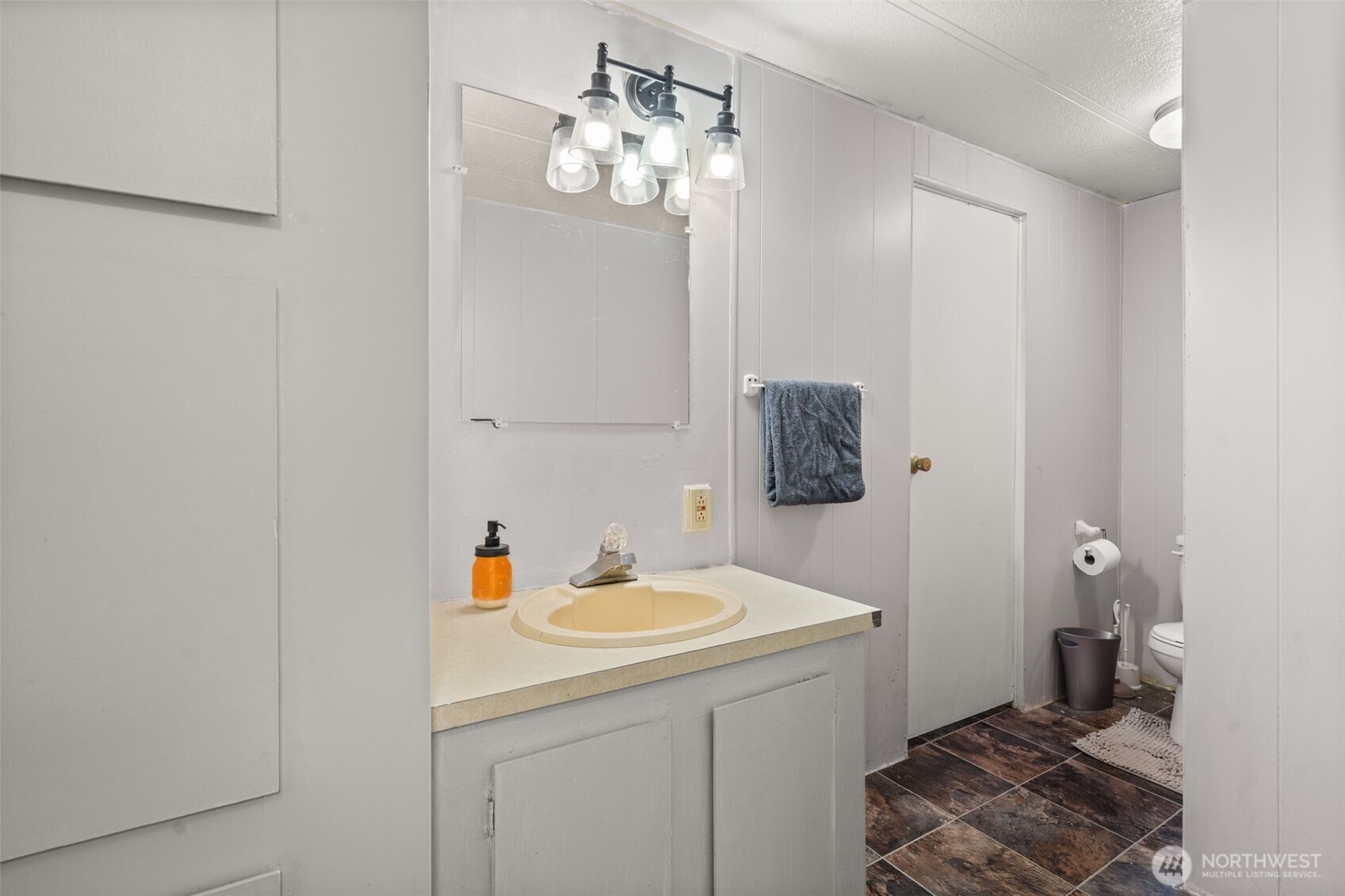 19121 Elderberry Street Southwest Rochester, WA 98579 - Photo 22 of 34 a bathroom with a sink and a mirror