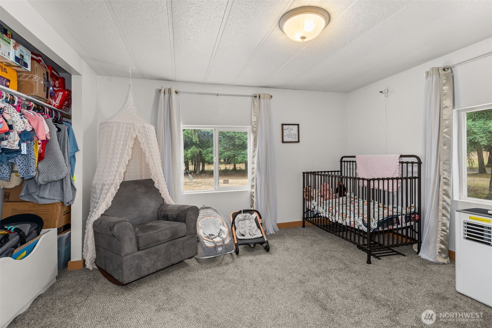 19121 Elderberry Street Southwest Rochester, WA 98579 - Photo 24 of 34 a living room with furniture and a window