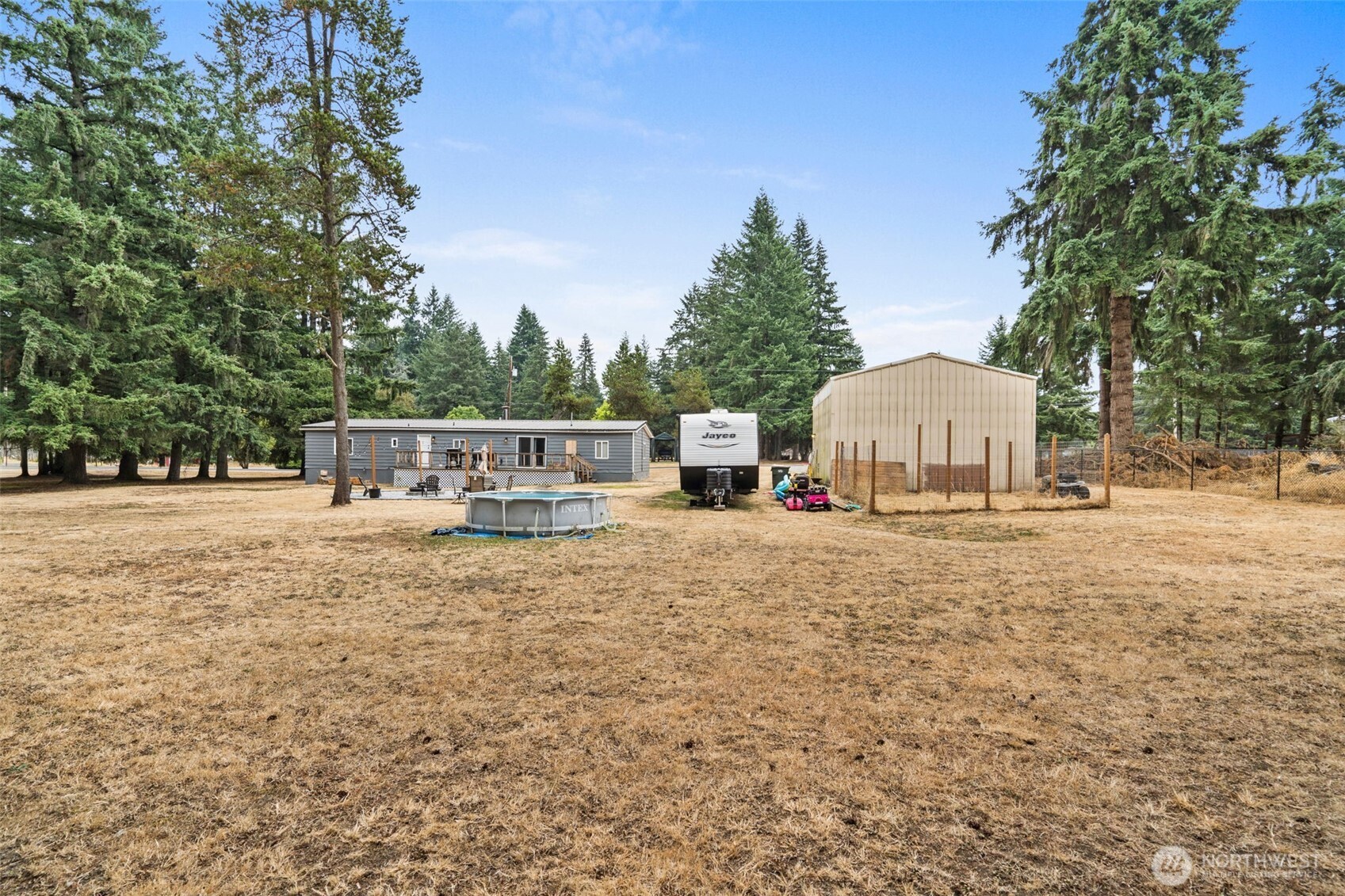 19121 Elderberry Street Southwest Rochester, WA 98579 - Photo 33 of 34 a view of a house with yard and sitting area