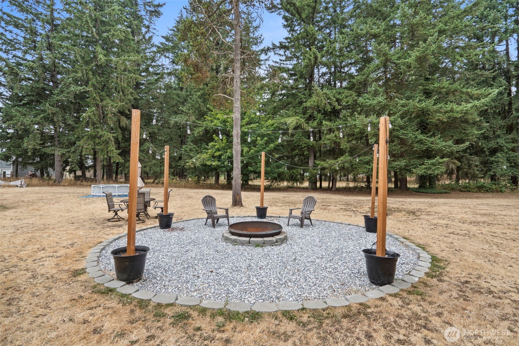 19121 Elderberry Street Southwest Rochester, WA 98579 - Photo 34 of 34 a large white building with swimming pool